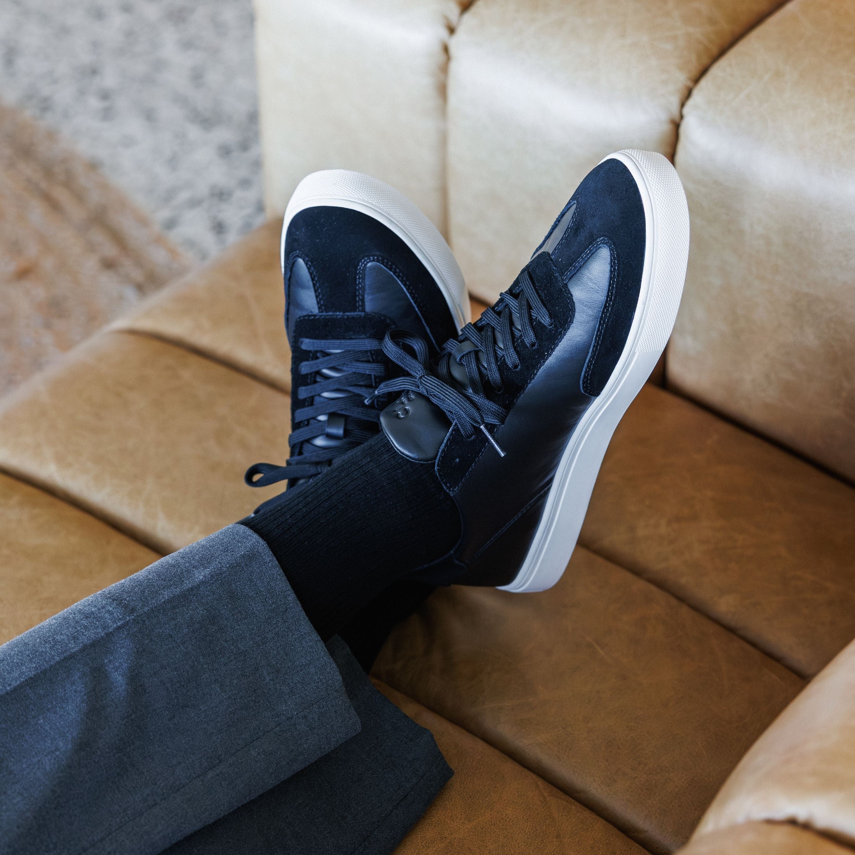 Deane court shoe in Black Off-White worn in casual lifestyle setting, highlighting comfort, durability, and premium materials.