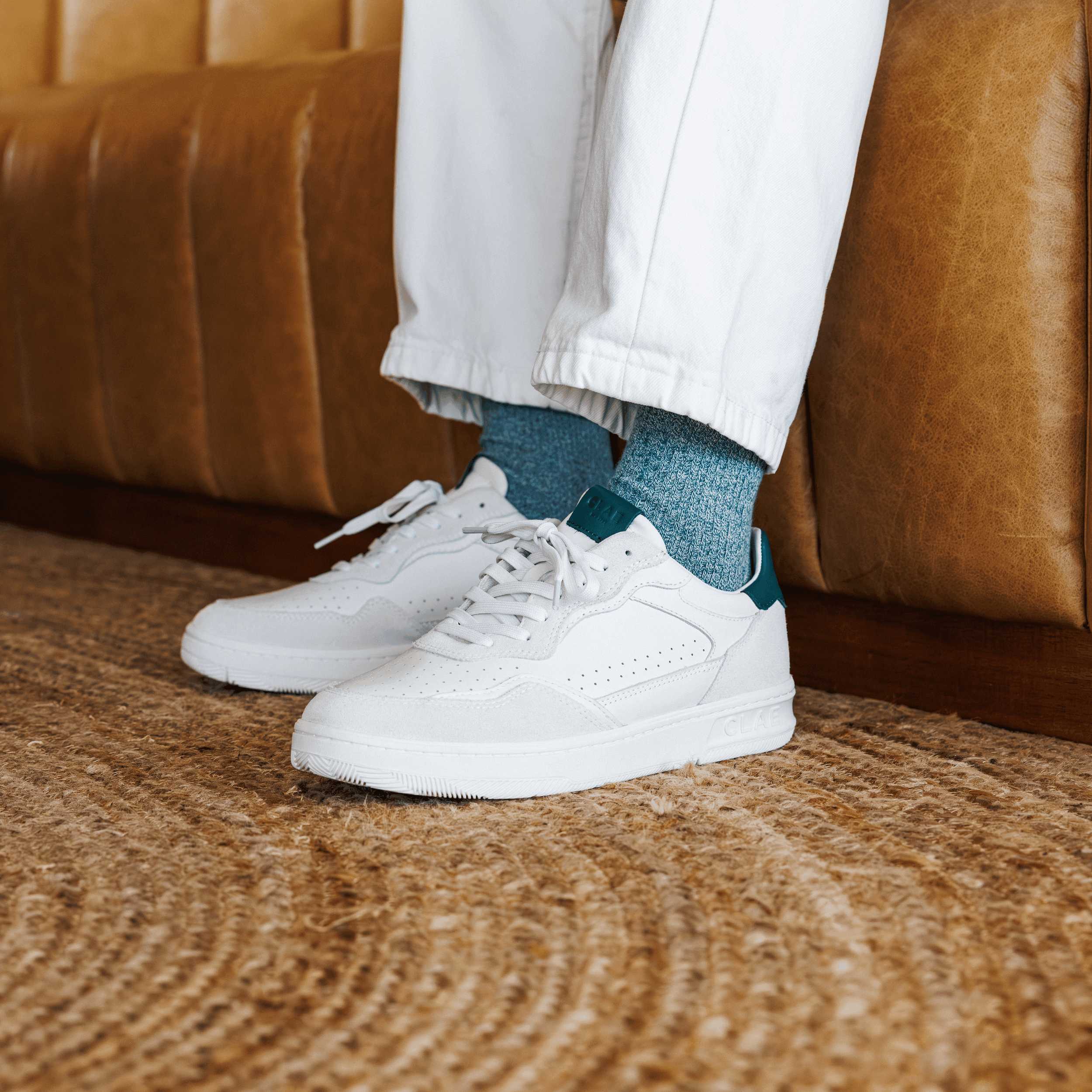 Haywood court shoe in White Pine Needle worn in casual lifestyle setting, highlighting premium materials and refined detailing.