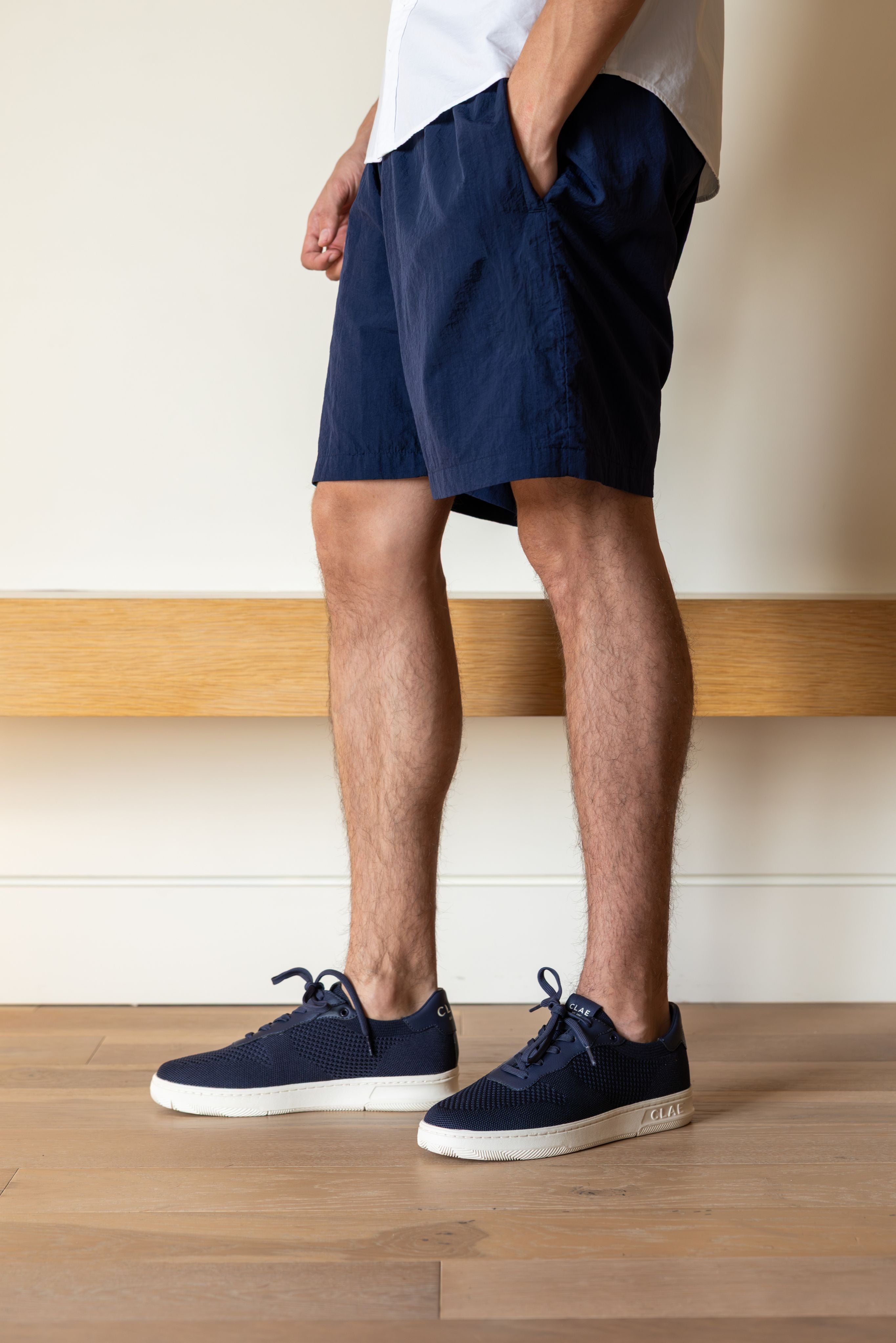Malone Knit shoe in Navy worn in casual lifestyle setting, highlighting comfort, breathability, and eco-friendly materials.