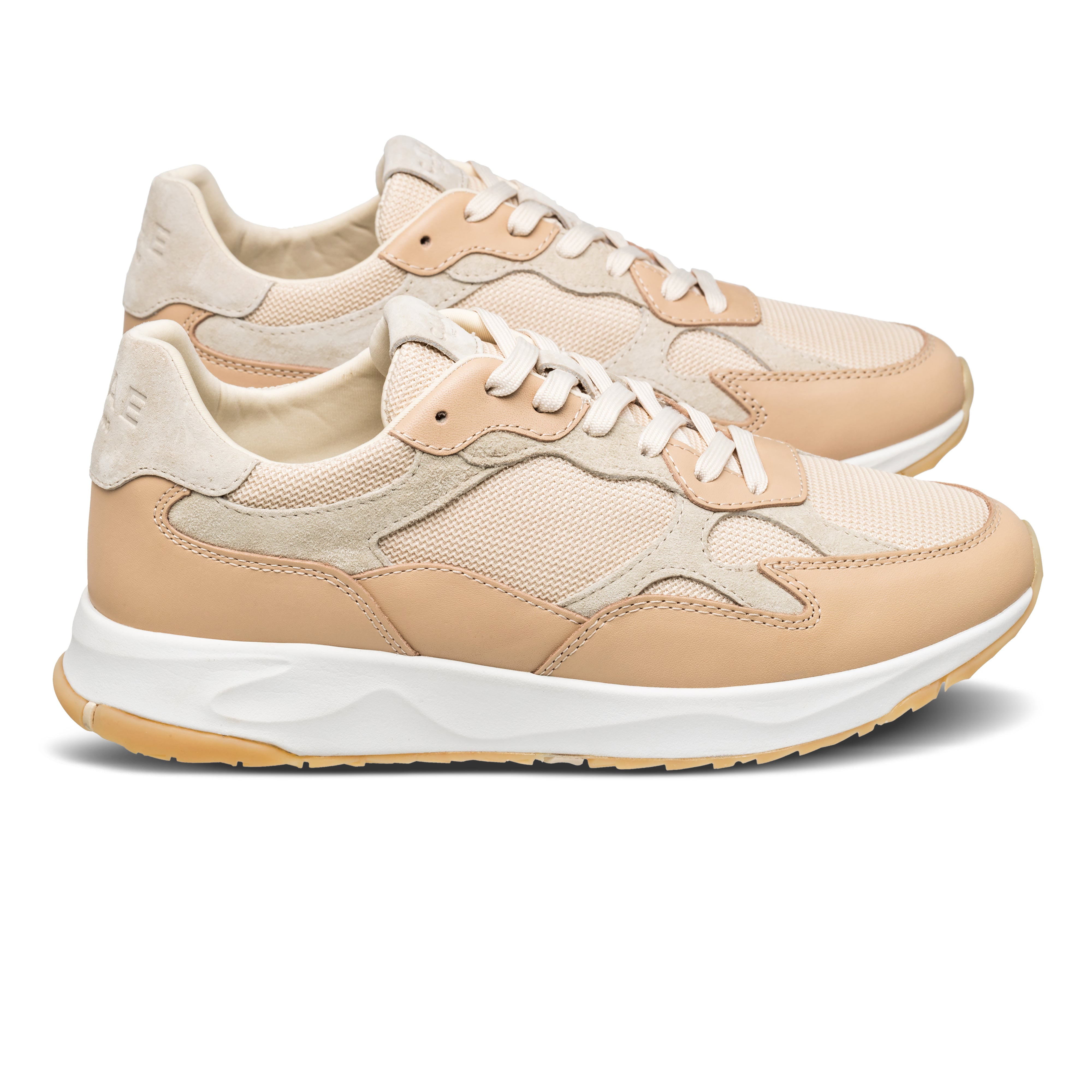 Zuma runner in Vegtan Wood Ash with leather, suede, and recycled mesh upper, side view showing premium runner silhouette and Desert Track outsole.