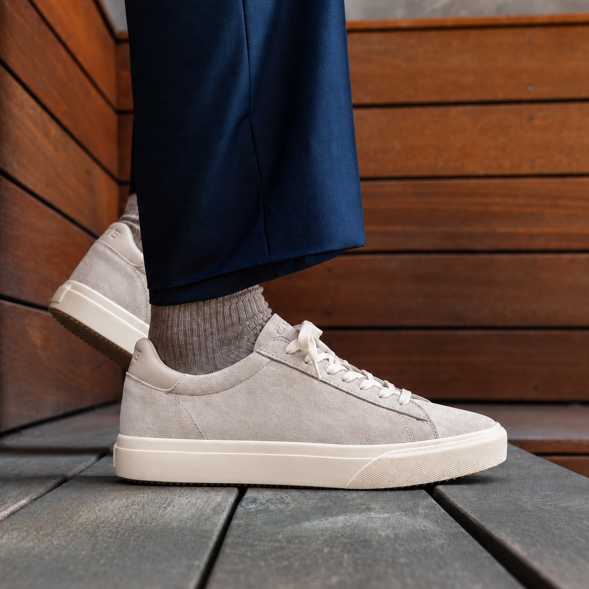 Bradley Venice Feather Grey Suede — lifestyle profile on wooden bench