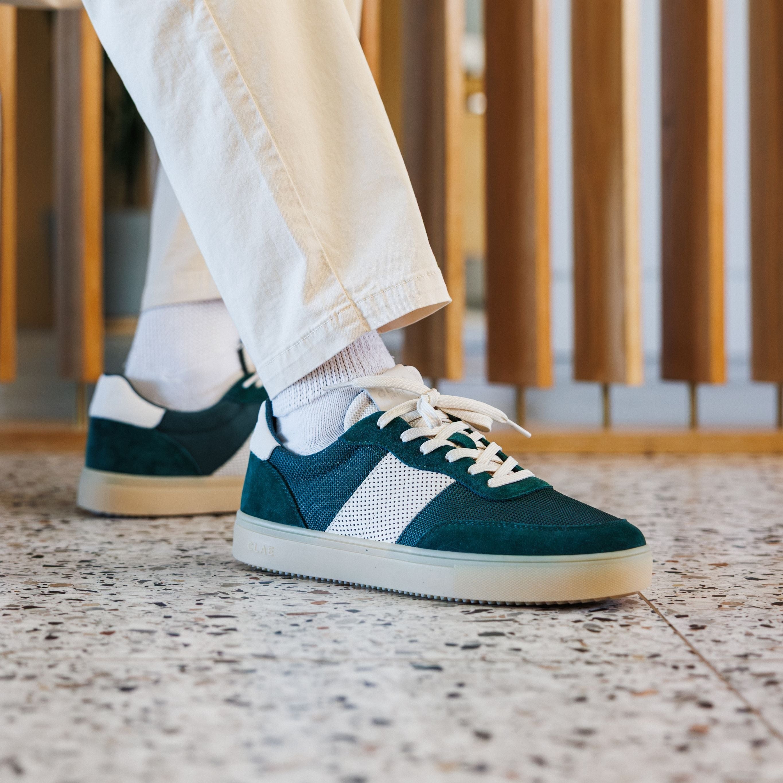 Davis court shoe in Pine Needle Off-White worn in casual lifestyle setting, highlighting comfort, durable materials, and premium craftsmanship.