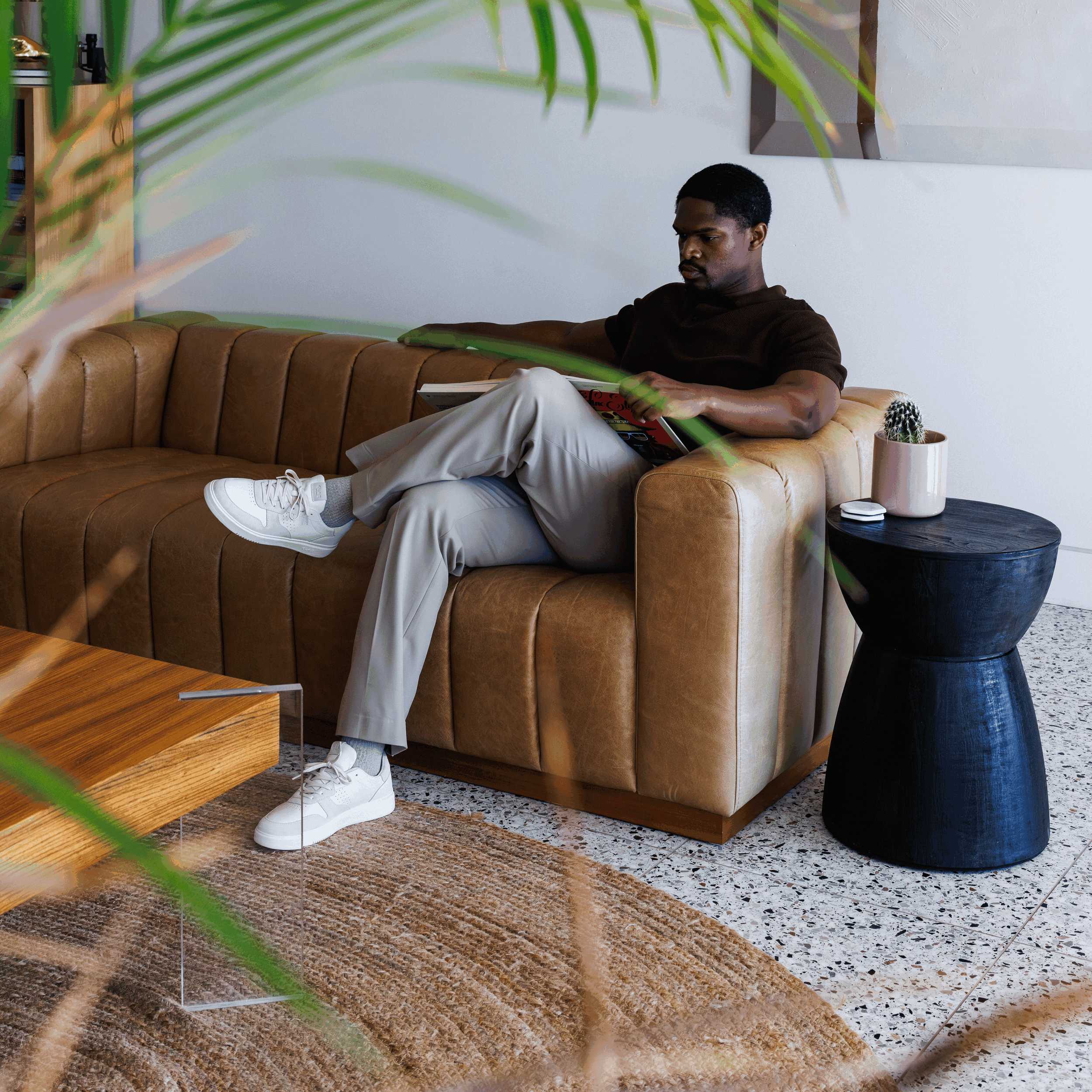 Moses sneaker in Triple Off-White worn in casual lifestyle setting, highlighting comfort, durability, and timeless style.